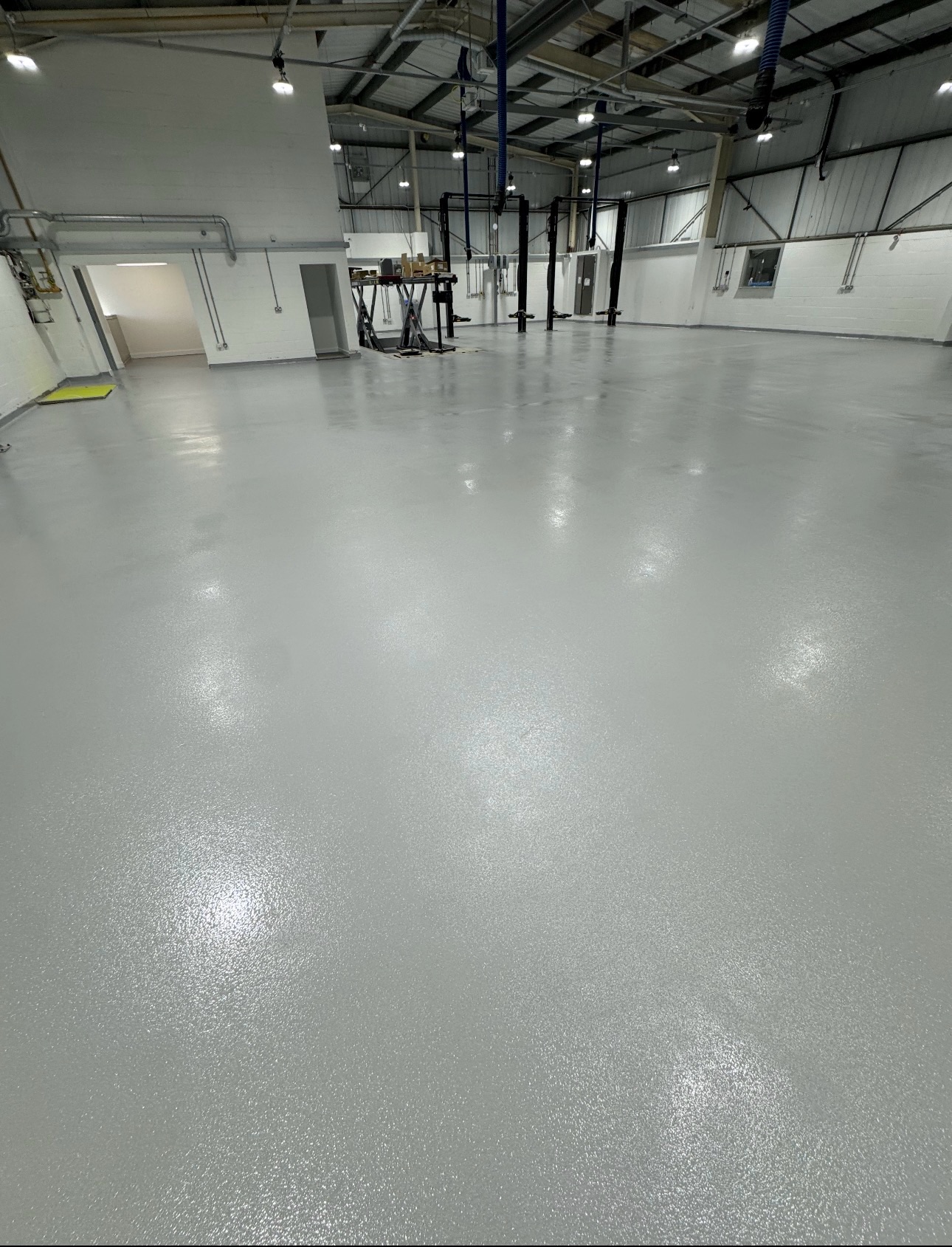 BMW Grimsby MOT & Servicing Centre – 300m² Anti-Slip Resin Flooring, industrial project completed by Anglia Decor