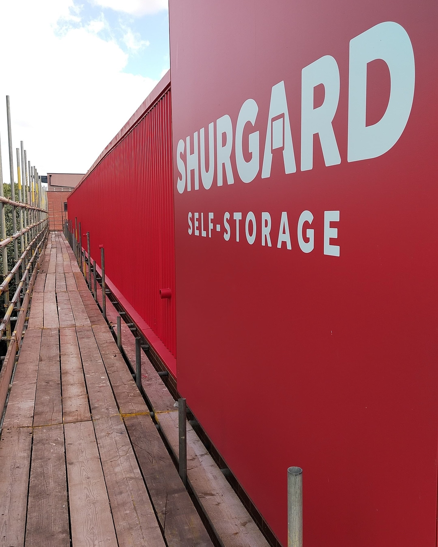 Cladding spraying with scaffold access