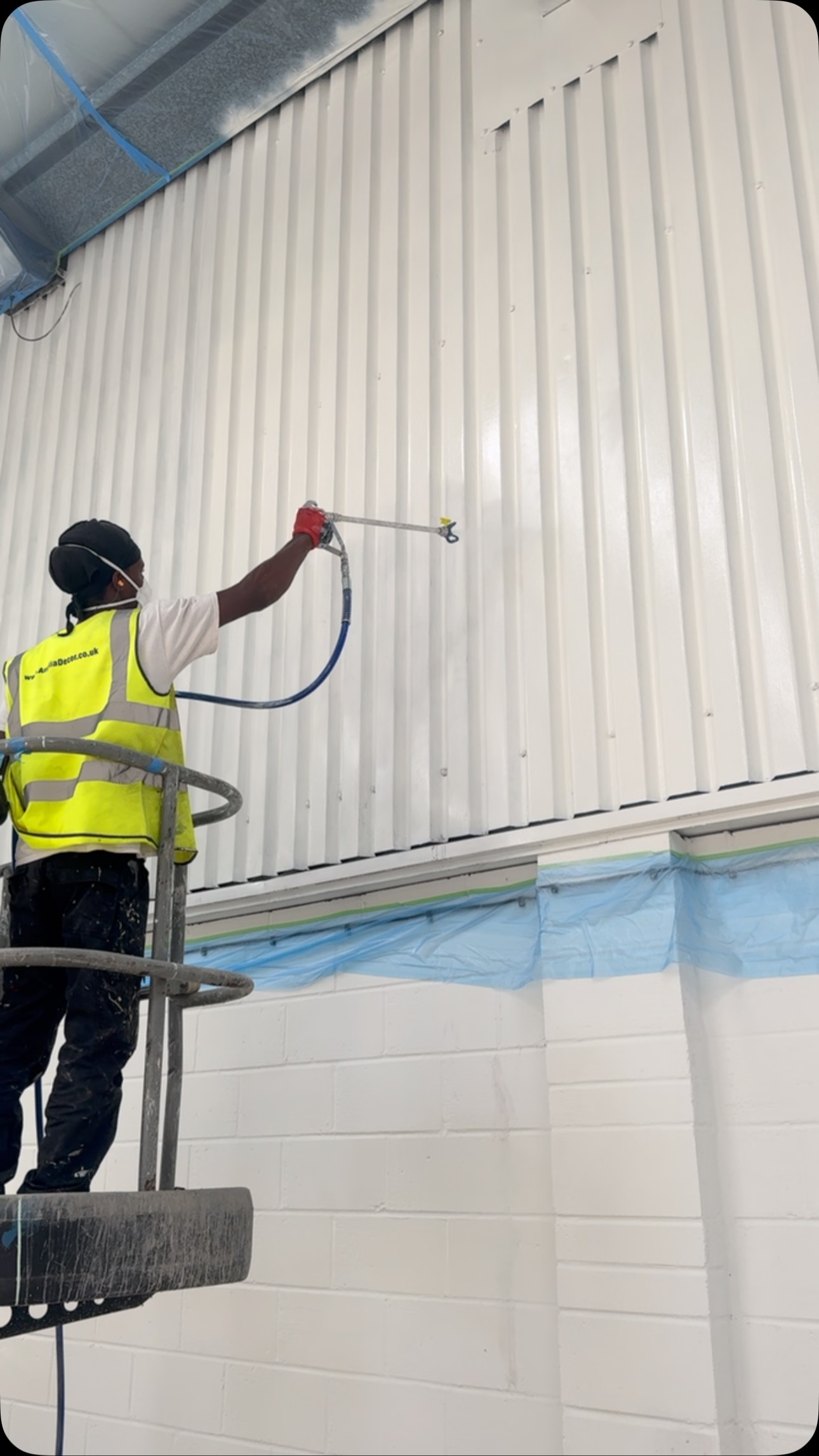 Spray painting metal cladding