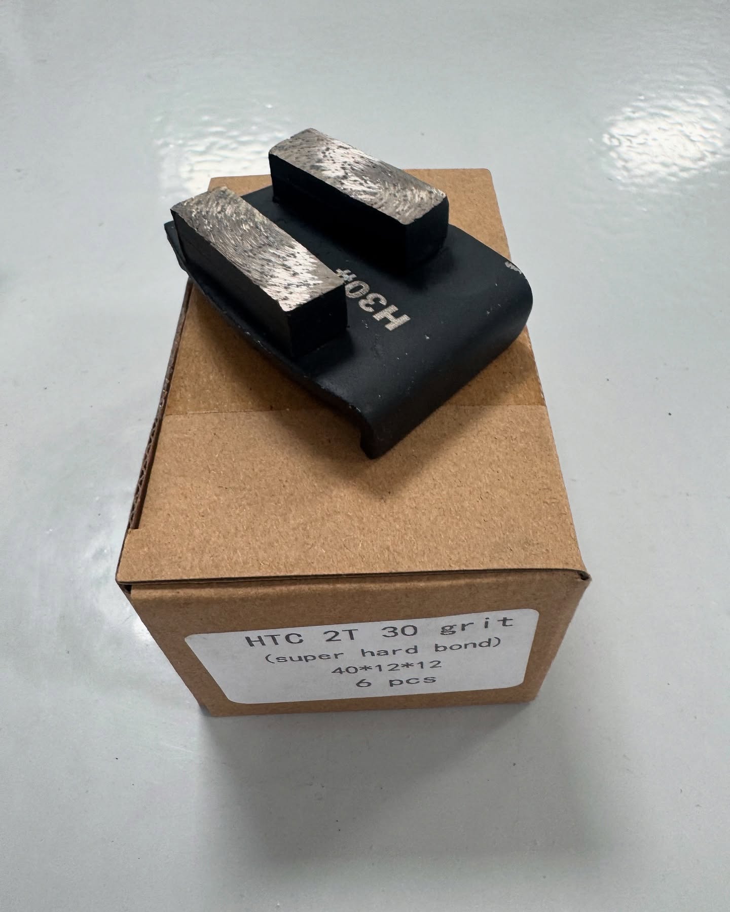 Surface preparation grinding before epoxy flooring application